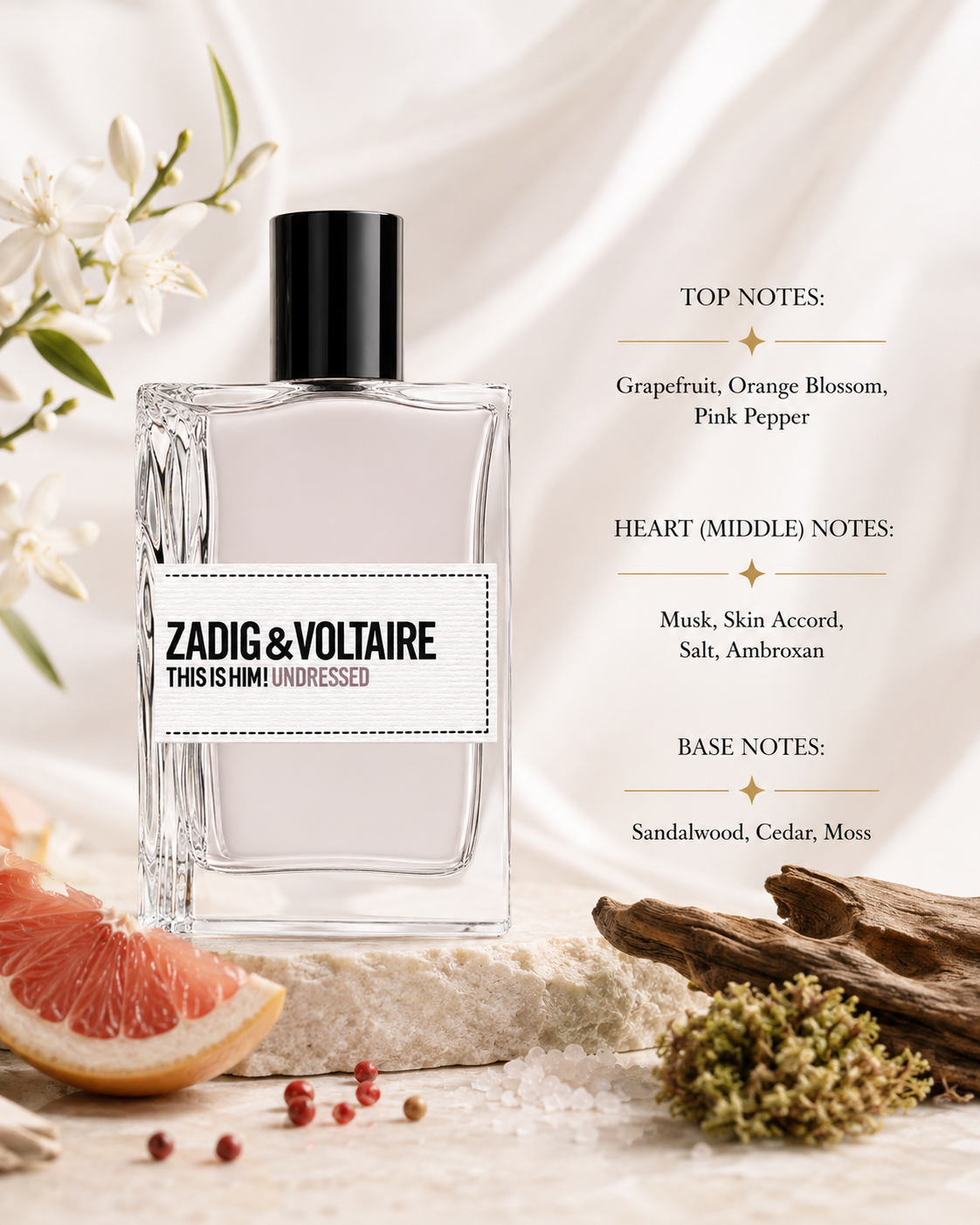 Zadig & Voltaire This Is Him! Undressed Eau de Toilette elegantly displayed on a refined beige travertine marble pedestal in warm natural sunlight. The composition is surrounded by freshly sliced pink grapefruit, delicate orange blossom flowers, scattered pink peppercorns, soft white musk-inspired textures, sea salt crystals, subtle amber resin representing ambroxan, smooth sandalwood pieces, cedar wood logs and natural green moss.