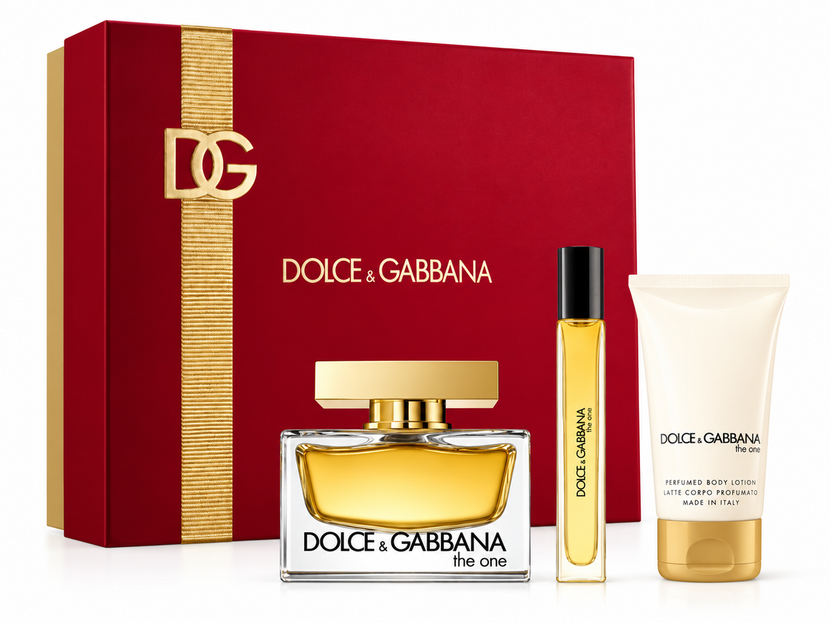 Dolce & Gabbana The One luxury fragrance gift set featuring an elegant rectangular perfume bottle with golden accents, a matching travel perfume spray and perfumed body lotion. Presented in a sophisticated red gift box with gold DG detailing, perfect for gifting and special occasions.