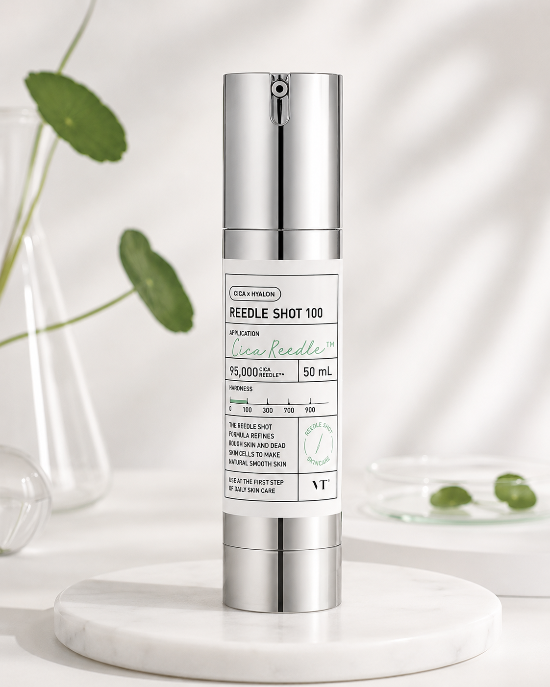 VT Cosmetics Reedle Shot 100 50ml elegantly displayed on a white marble tray in a bright minimalist skincare setting with soft natural light, fresh centella leaves and clean glass accents, highlighting its innovative skin-renewing formula, pore-refining benefits, lightweight texture and premium Korean skincare aesthetic for radiant, refined and healthy-looking skin.