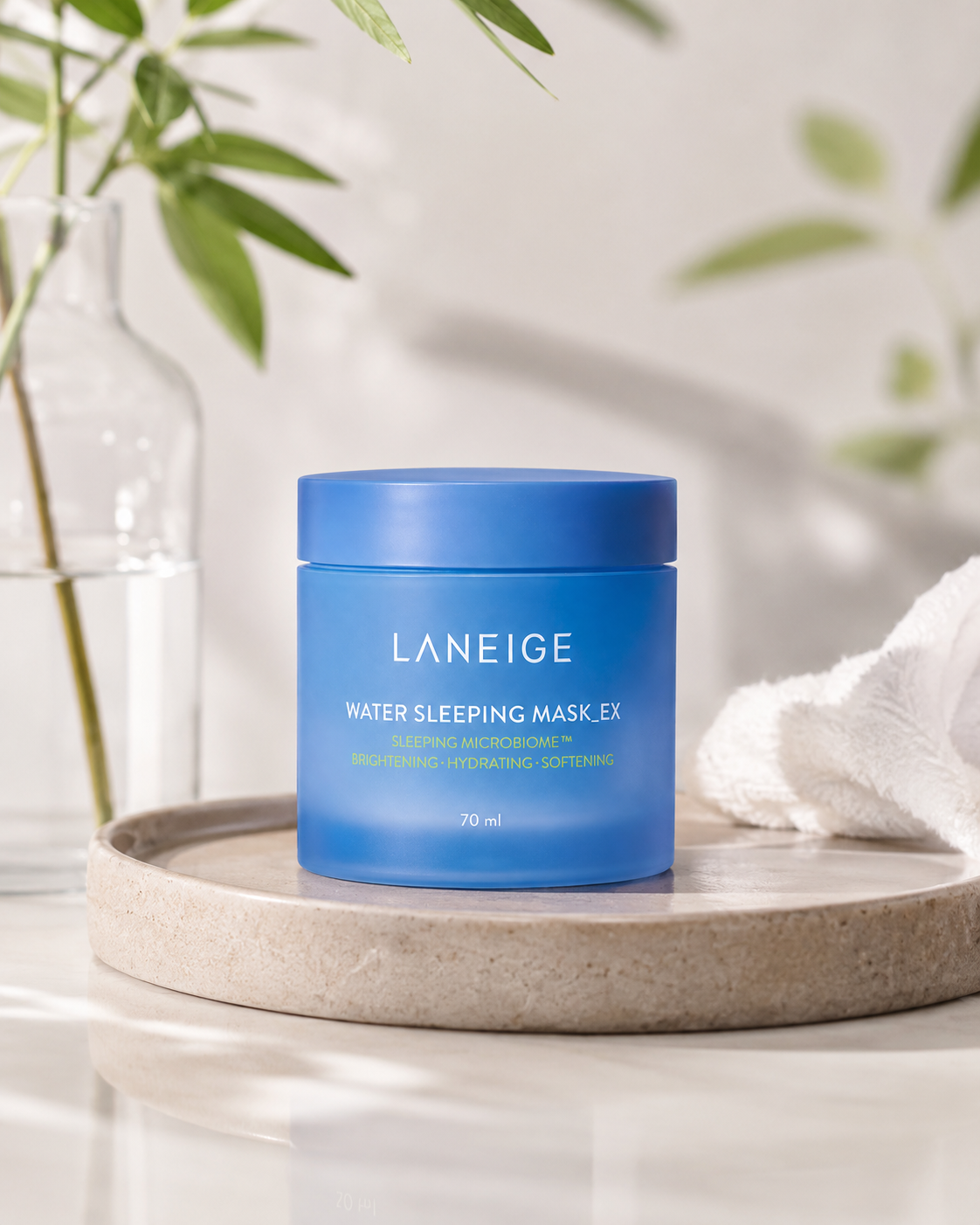 Laneige Water Sleeping Mask 70ml on a white surface with greenery in the background